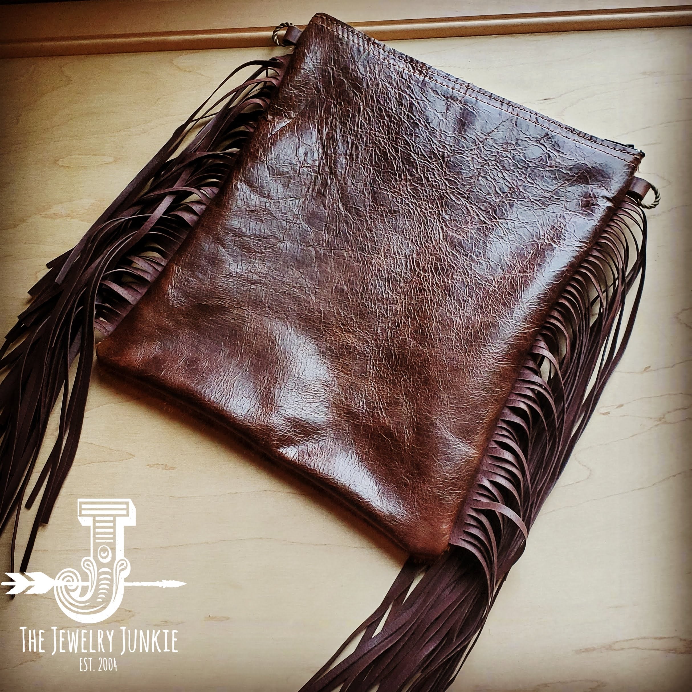Faux axis deer cowhide bohowestern bag with long black fringe and